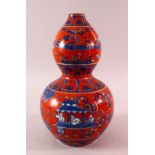 A MING STYLE CORAL RED DOUBLE GOUD PORCELAIN VASE - with blue & white decoration of figures and