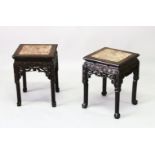 A PAIR OF CHINESE SQUARE FORM MARBLE INSET HARDWOOD STANDS, the frieze carved with bands of floral