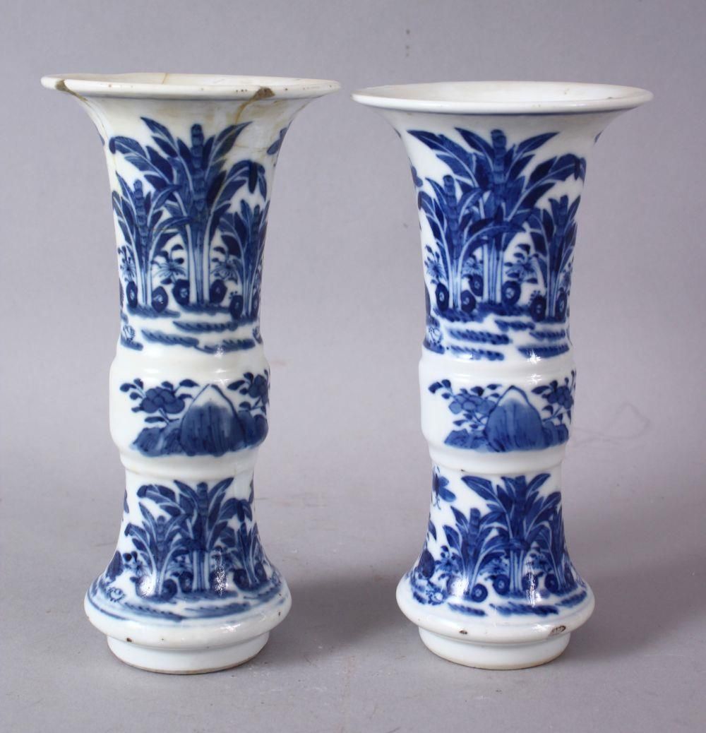 A PAIR OF 19TH CENTURY OR LATER CHINESE BLUE & WHITE PORCELAIN GU VASES, The body of the vases