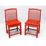 A PAIR OF CHINESE RED LACQUER STICK BACK SIDE CHAIRS, with panelled solid seats and stretchered