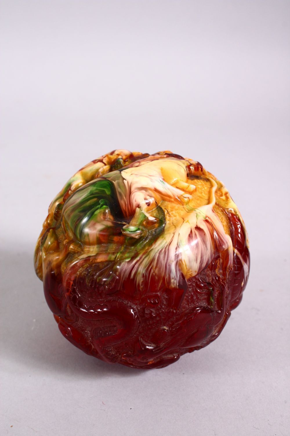 A CHINESE CARVED BAKELITE OR CHERRY AMBER ZODIAC BALL, carved with animals, 9cm diameter. - Image 3 of 8