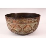 A LARGE ISLAMIC CALLIGRAPHIC BRONZE BOWL - the body carved with calligraphy and floral motif, 24cm