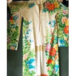 A GOOD HEAVY SILK KIMONO with colourful tropical floral decoration, approx 5ft 4in long.