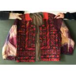 A SHORT COTTON JACKET, made up with embroidered panels, approx. 44in chest x 24in long.