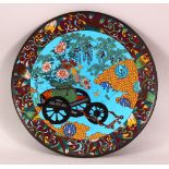 A JAPANESE MEIJI PERIOD CLOISONNE DISH - decorated with a blue ground depicting native display if