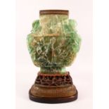 A LARGE AND IMPRESSIVE CHINESE CARVED GREEN QUARTZ VASE / LAMP, on a carved hardwood peach formed