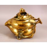 AN UNUSUAL CHINESE PEACH FORMED BRONZE CENSER, the body formed as a peach, stood upon tripod legs