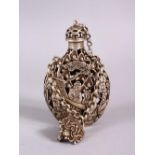 A CHINESE WHITE METAL OPENWORK SNUFF BOTTLE, with decoration in openwork and depicting immortal