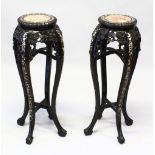 A GOOD PAIR OF LATE 19TH CENTURY CHINESE CARVED HARDWOOD TALL STANDS, each inset with a circular