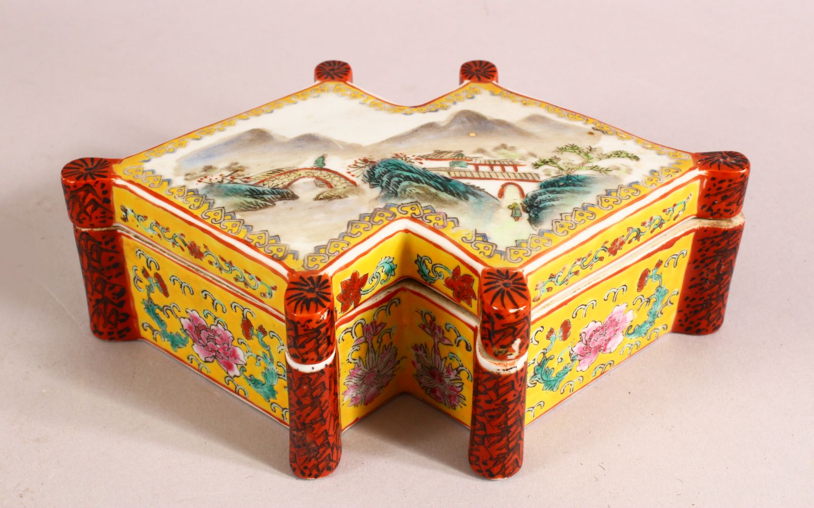 A CHINESE FAMILLE ROSE PORCELAIN BOX & COVER - the li decorated with a landscape view with a red