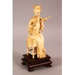 A 19TH / 20TH CENTURY CHINESE CARVED IVORY SEATED MUSICIANS, the female figure in a seated