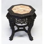 A CHINESE CARVED HARDWOOD AND MARBLE INSET OCTAGONAL SHAPED STAND, the frieze carved and pierced