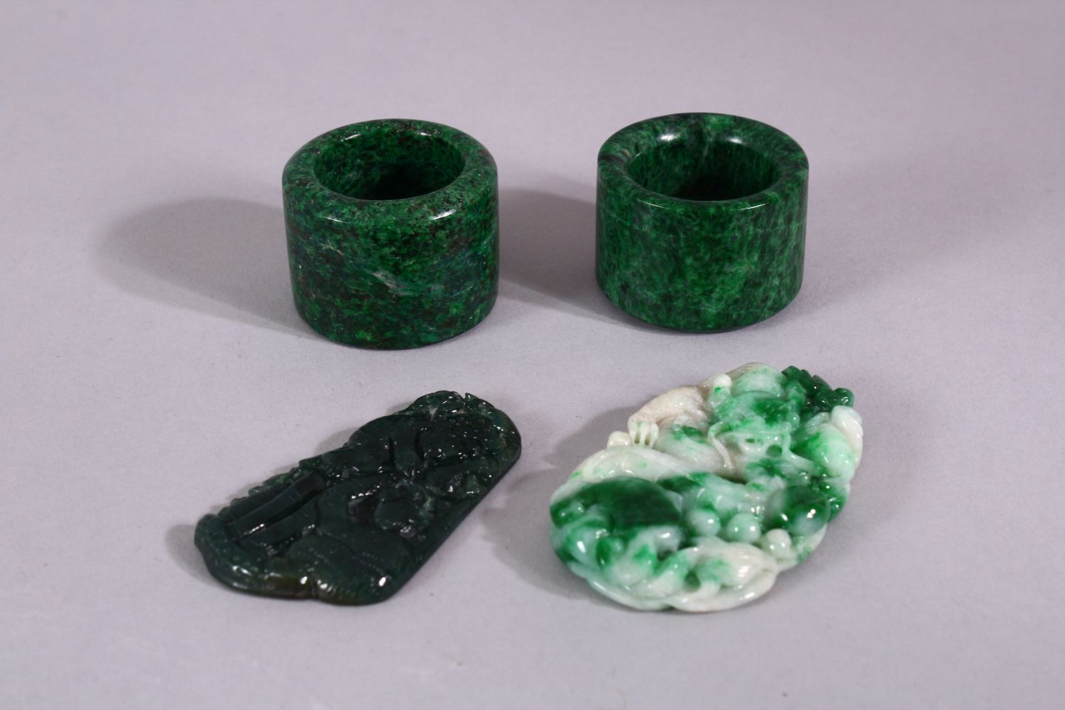 FOUR JADEITE PIECES.