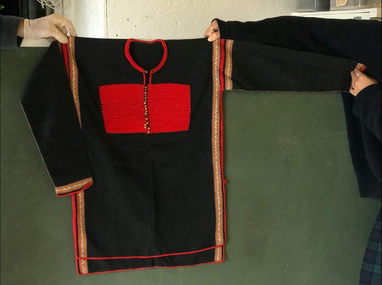 AN UNUSUAL ETHNIC JACKET, 20th Century, possibly Chinese minority people, red embroidered on a black - Image 2 of 2