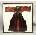 A 19TH CENTURY OR EARLIER UZBEK OR TIBETAN DRESS, with embroidered and mirrored sleeves and plum