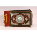 A PERSIAN LACQUER, WHITE METAL & ENAMEL ARTIST BOOK - the cover with in inset enamel plaque of a