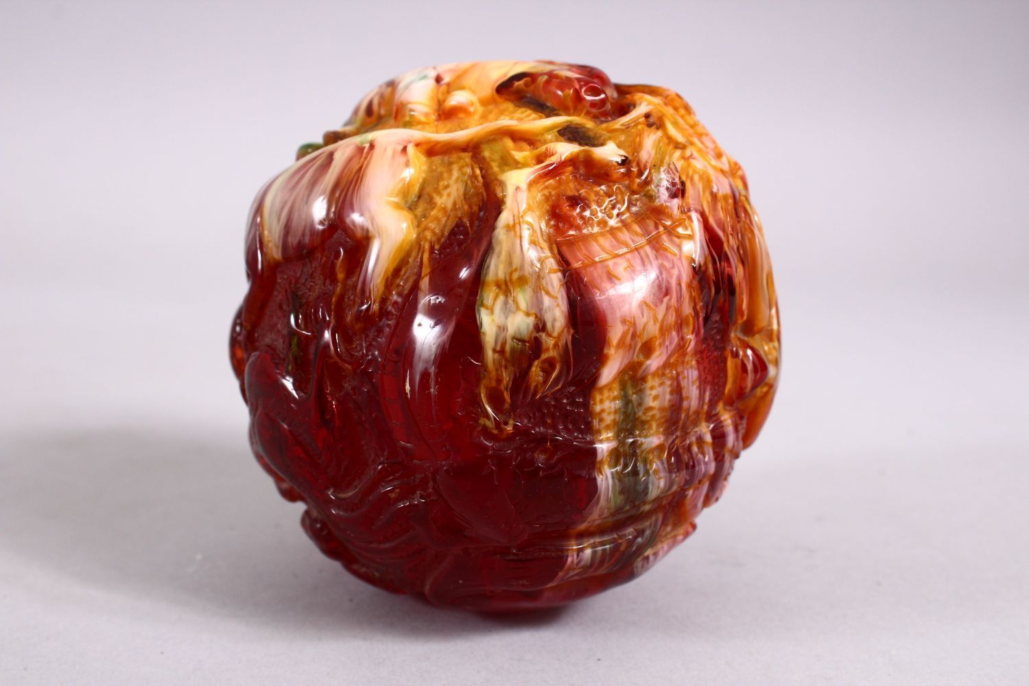 A CHINESE CARVED BAKELITE OR CHERRY AMBER ZODIAC BALL, carved with animals, 9cm diameter. - Image 4 of 8