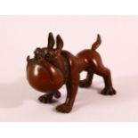 A JAPANESE BRONZE FIGURE OF A DOG - bell to collar and seal to belly, 9cm