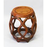 A CHINESE HARDWOOD BARREL SEAT, with lattice work sides, 30cm diameter, 45cm high.