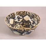 A 19TH CENTURY OR EARLIER TURKISH POTTERY BOWL, with floral motif decorations, (af) 18.5cm