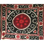 A HAND EMBROIDERED BLACK AND RED WALL COVERING / BEDSPREAD, circa 1920, Tashkent Susani, 5ft x 4ft