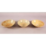 THREE EARLY CHINESE POTTERY BOWLS, of varying style and size (3)