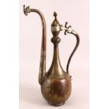 AN ISLAMIC SAFAVID TINNED COPPER EWER, the body with engraved decoration, the handle and spout