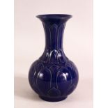 A CHINESE BLUE GLAZED PORCELAIN MOULDED VASE - 17.5cm high.