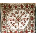 A SUSANI WEDDING DOWRY, 20th Century, with red and green silk floral embroidery on a beige cotton