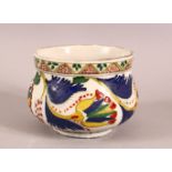 A TURKISH KUTAHYA POTTERY DECORATED BOWL - decorated with multi coloured glaze depicting flora and