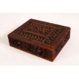 A 19TH / 20TH CENTURY INDIAN CARVED WOODEN BOX - the box with a removable lid revealing storage