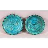 A PAIR OF 12TH/13TH CENTURY PERSIAN SELJUK KASHAN TURQUOISE GLAZED DISHES, the centre with horse and