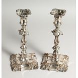 A PAIR OF 19TH CENTURY SHEFFIELD PLATE CANDLESTICKS of Georgian design. 9ins high