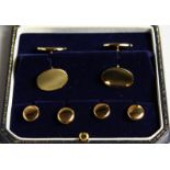 A GOLD-PLATED DRESS SET, comprising a pair of cufflinks and four studs.