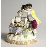 A 19TH CENTURY MEISSEN PORCELAIN GROUP OF A YOUNG BOY AND GIRL with encrusted garlands on an oval