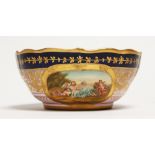 A VIENNA CIRCULAR BOWL, blue and gilt border painted with two ovals. Mark in blue 6ins diameter.