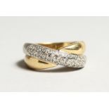 AN 18CT GOLD DIAMOND SET CROSS OVER RING