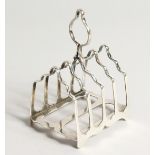 A FOUR DIVISION SILVER TOAST RACK Sheffield 1908