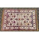 A GOOD SMALL SOUF KASHAN SILK RUG, beige ground with stylised palmettes, within a similar border.