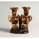 AN UNUSUAL SLIP/TREACLE GLAZED POTTERY PEN STAND/VASE, possibly Chanakkale Turkish.