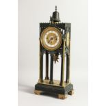 A GOOD GOTHIC DESIGN BRONZE AND ORMOLU CLOCK, the dial with 2 rings 1 - 12 & 1 - 31. 18ins high.