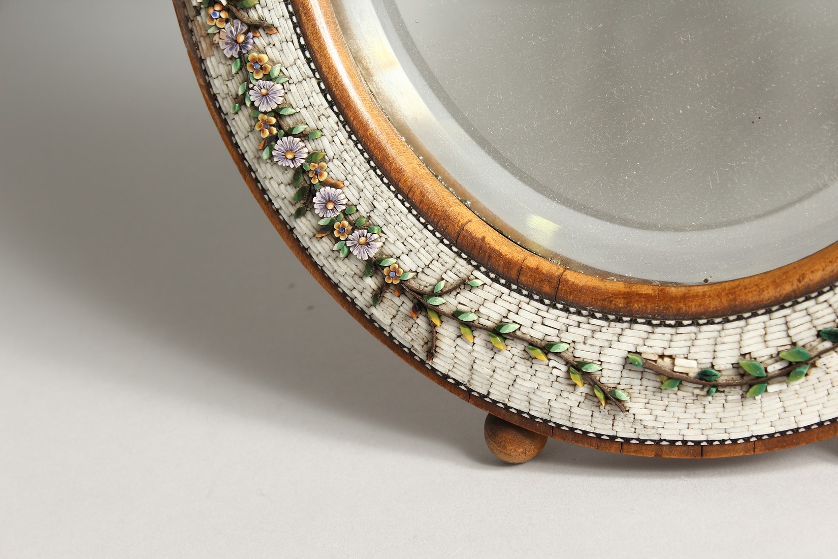 A GOOD MOSIAC FRAMED SHAPED EASEL MIRROR with a band of flowers 13.5ins high. - Image 4 of 8