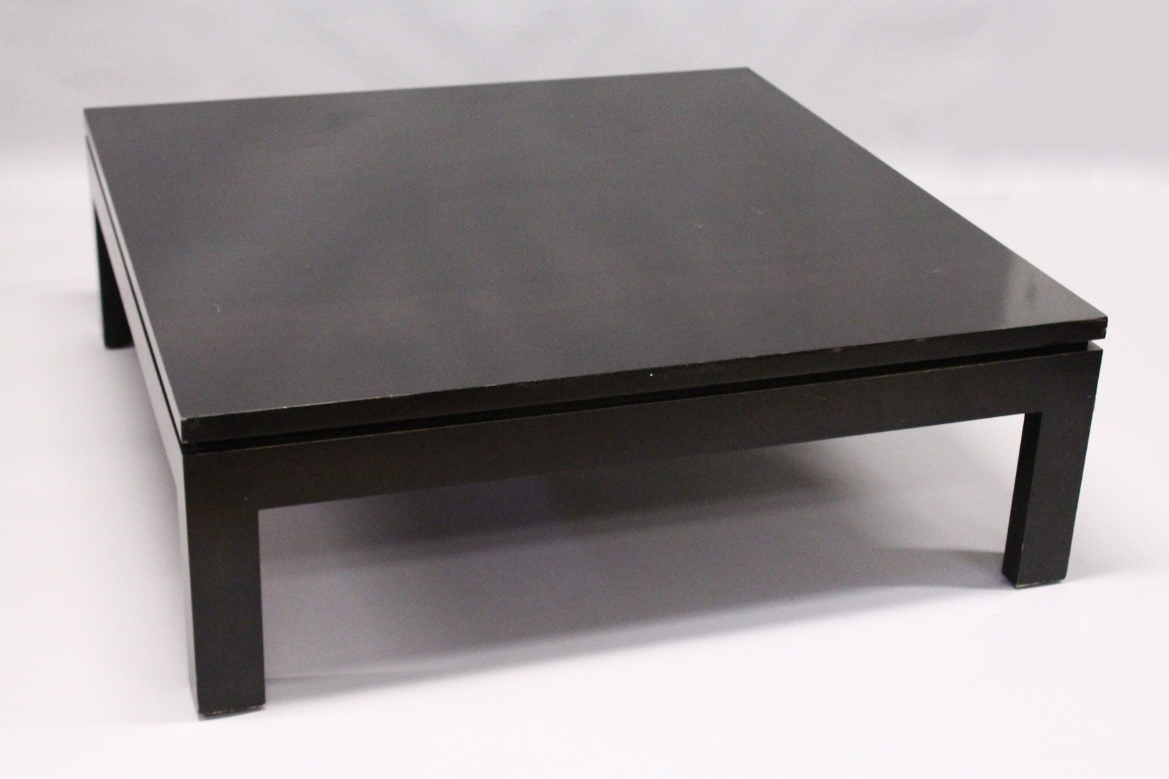 A LARGE EBONISED COFFEE TABLE, 20TH CENTURY, on square legs. 3ft 11.5ins x 3ft 11.5ins x 1ft 4ins.