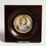 A CIRCULAR PORTRAIT MINIATURE OF A YOUNG BOY Signed Garet 2ins diameter in a wooden frame.