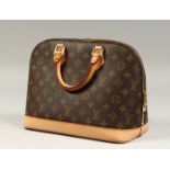 A LOUIS VUITTON LEATHER BAG, as new with dust cover.