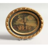 AN ITALIAN GILDED WOOD OVAL PICTURE, dancing cherubs 4ins x 5ins