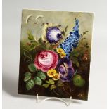 A GERMAN PORCELAIN PLAQUE PAINTED with flowers 9ins x 7.25ins