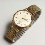 A 9CT GOLD TUDOR ROLEX WRISTWATCH with fixo-flex bracelet.