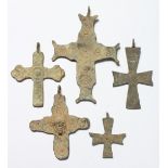 FIVE MEDIUM METAL ROMAN CROSSES. 3ins long