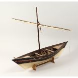 A EAST AFRICAN PAINTED WOOD MODEL OF A DOW (BOAT) 42ins high x 14ins wide.